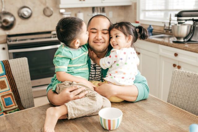 U-visa-service father hugging his kids in indianapolis after his u-visa is approved