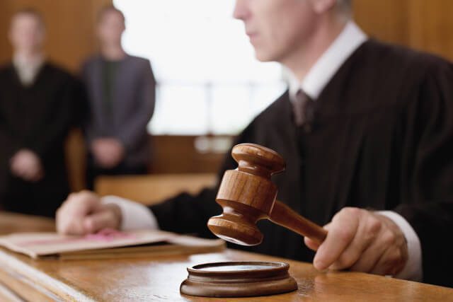 immigration-court-legal-service an immigration court judge banging his gavel in indianapolis