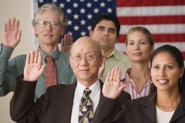 naturalization-legal-service a group of immigrants completing the naturalization process in indianapolis